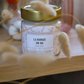 Bougie-Bijou du 88 Ménilmontant - parfum FLEUR DE CERISIER - 150g de cire & un bijoux en acier inoxydable